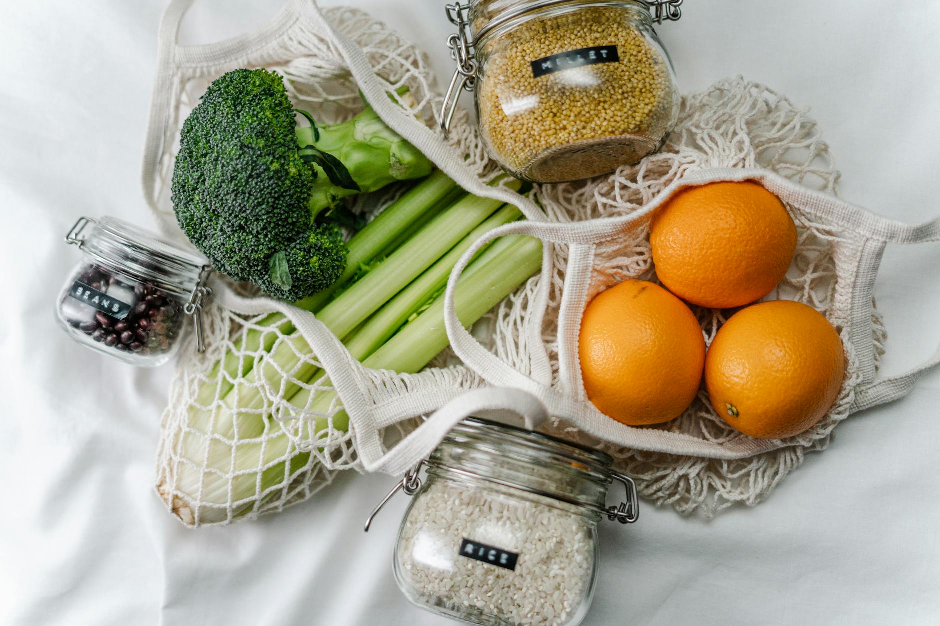 orange fruits in mesh bag